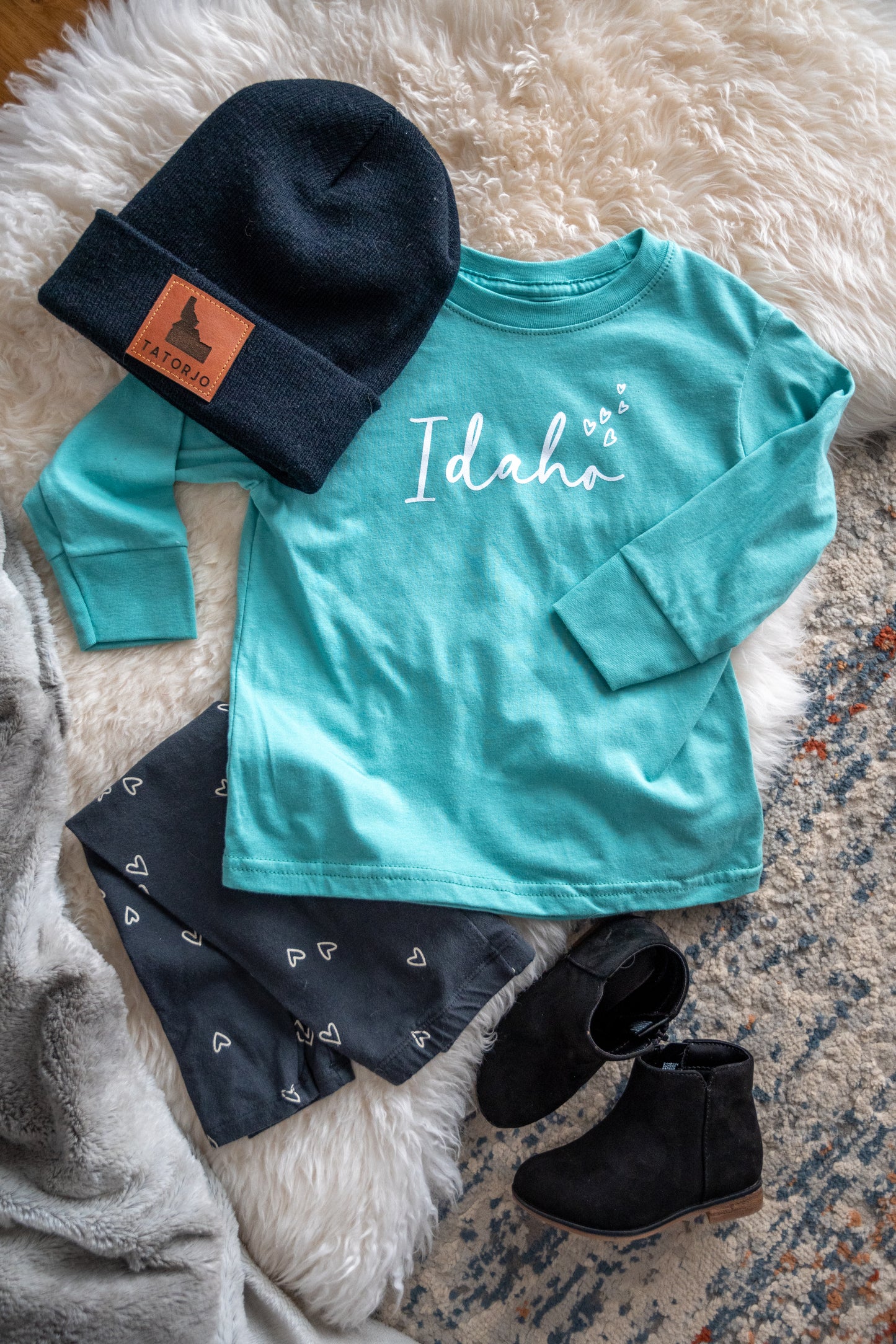Made in Idaho. Idaho apparel. Idaho toddler shirt. Toddler shirts Idaho. Idaho clothes. Idaho long sleeve. Teal IDaho Long sleeve.
