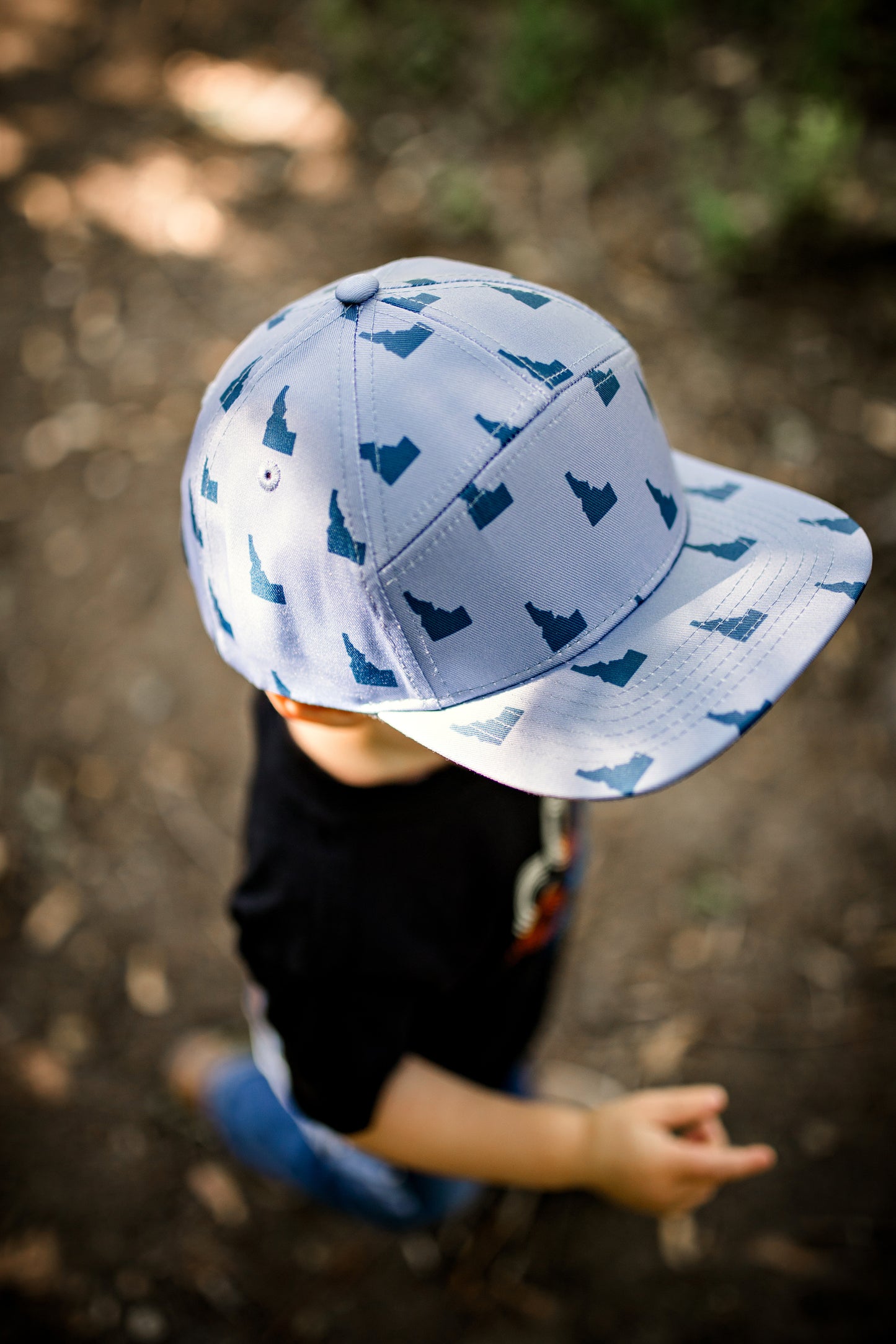 Idaho hat. This little boy wearing an Idaho hat outside in Idaho.