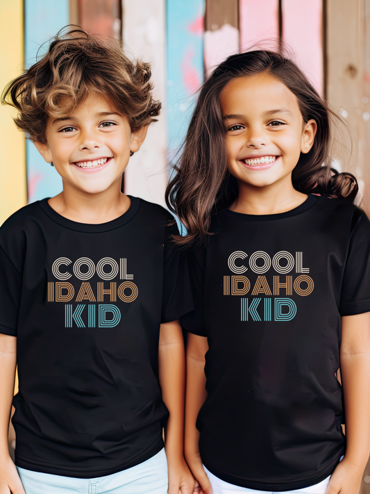 Idaho Cool Kid on a black Idaho made t-shirt. The perfect Idaho apparel, and sold only at TatorJo.