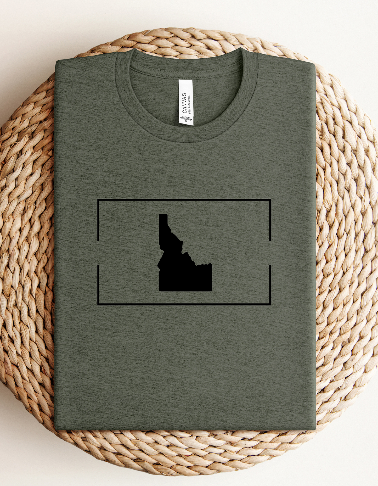 The green Idaho shirt is simple and clean looking with a simple Idaho design on it.