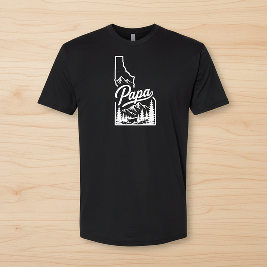 Black t-shirt with 'Papa' and Idaho outline design on a white background