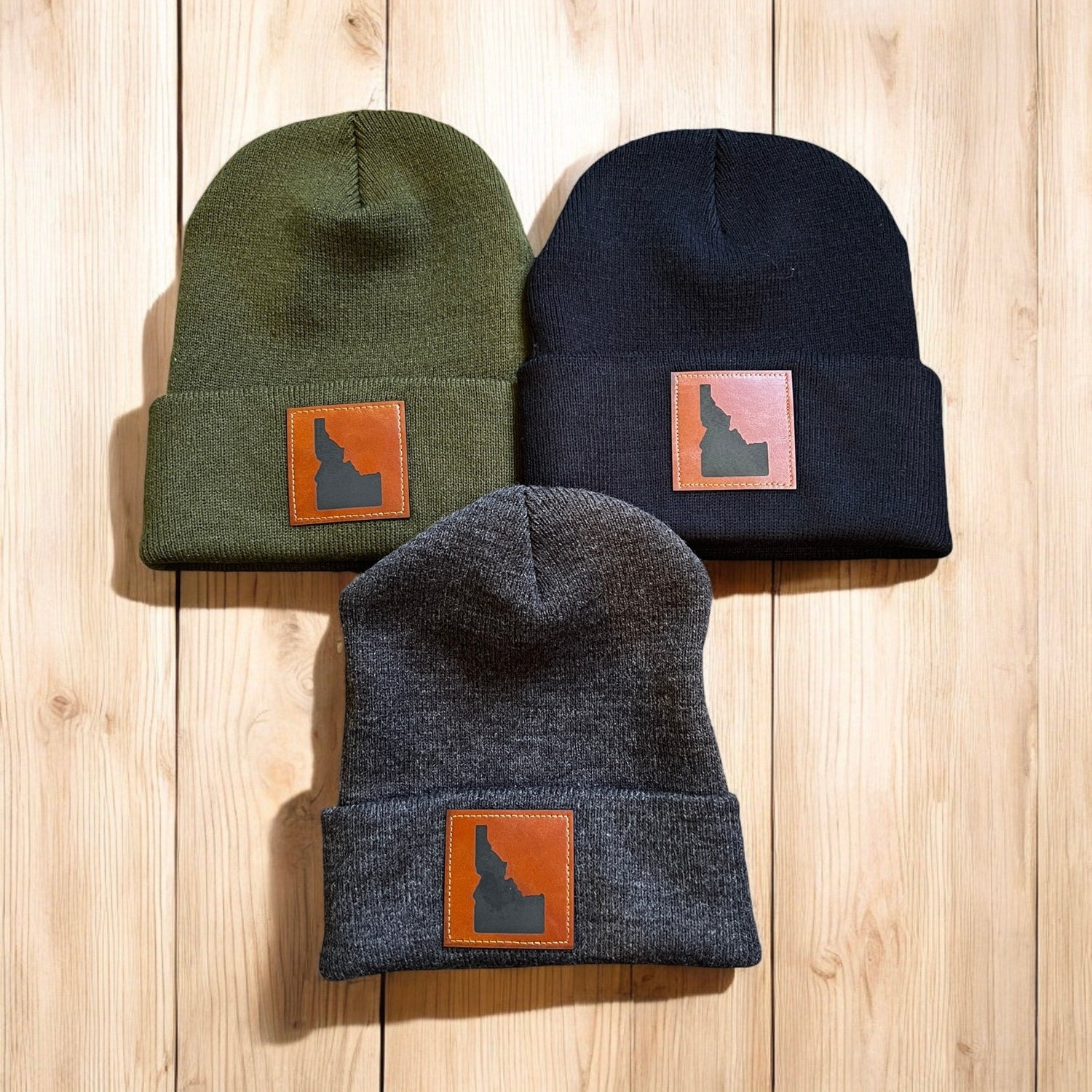 Image shows a tank top with the word Idaho on it, and an Idaho hat. Perfect Idaho summer outfit