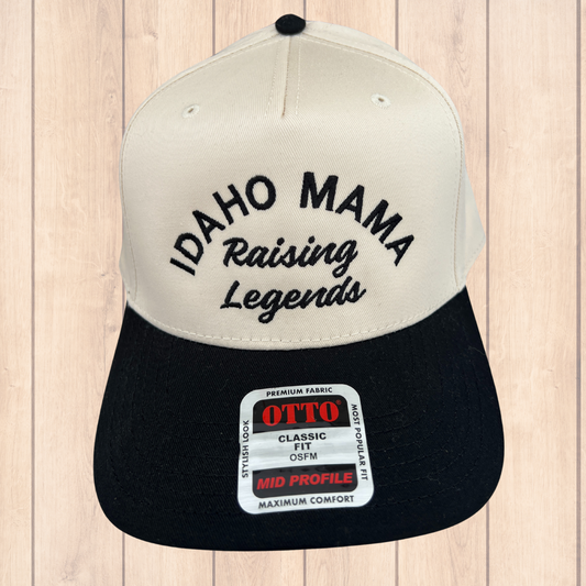 This seven panel vintage style hat is black and natural colored. This Idaho hat has the words Idaho Mama Raising Legends on it. This Idaho hat is a classic, statement for those rockstar Idaho mamas.