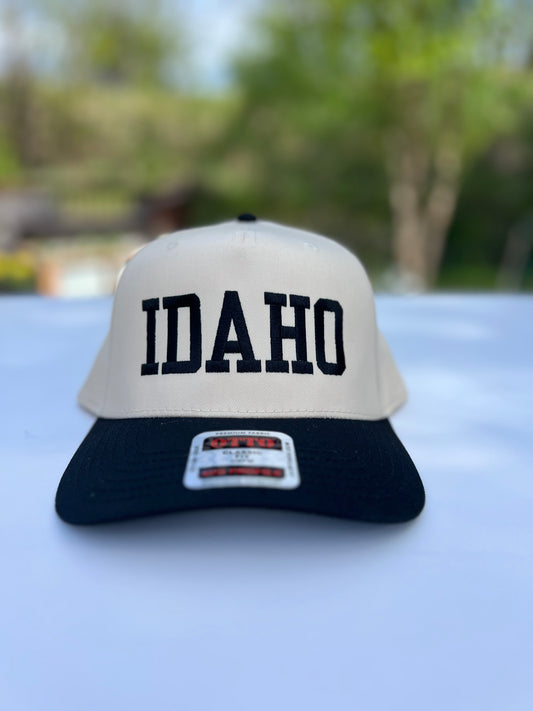 This Idaho Hat says idaho on it. Plain, simple text on a classic style hat. Idaho Hats, designed by TatorJo
