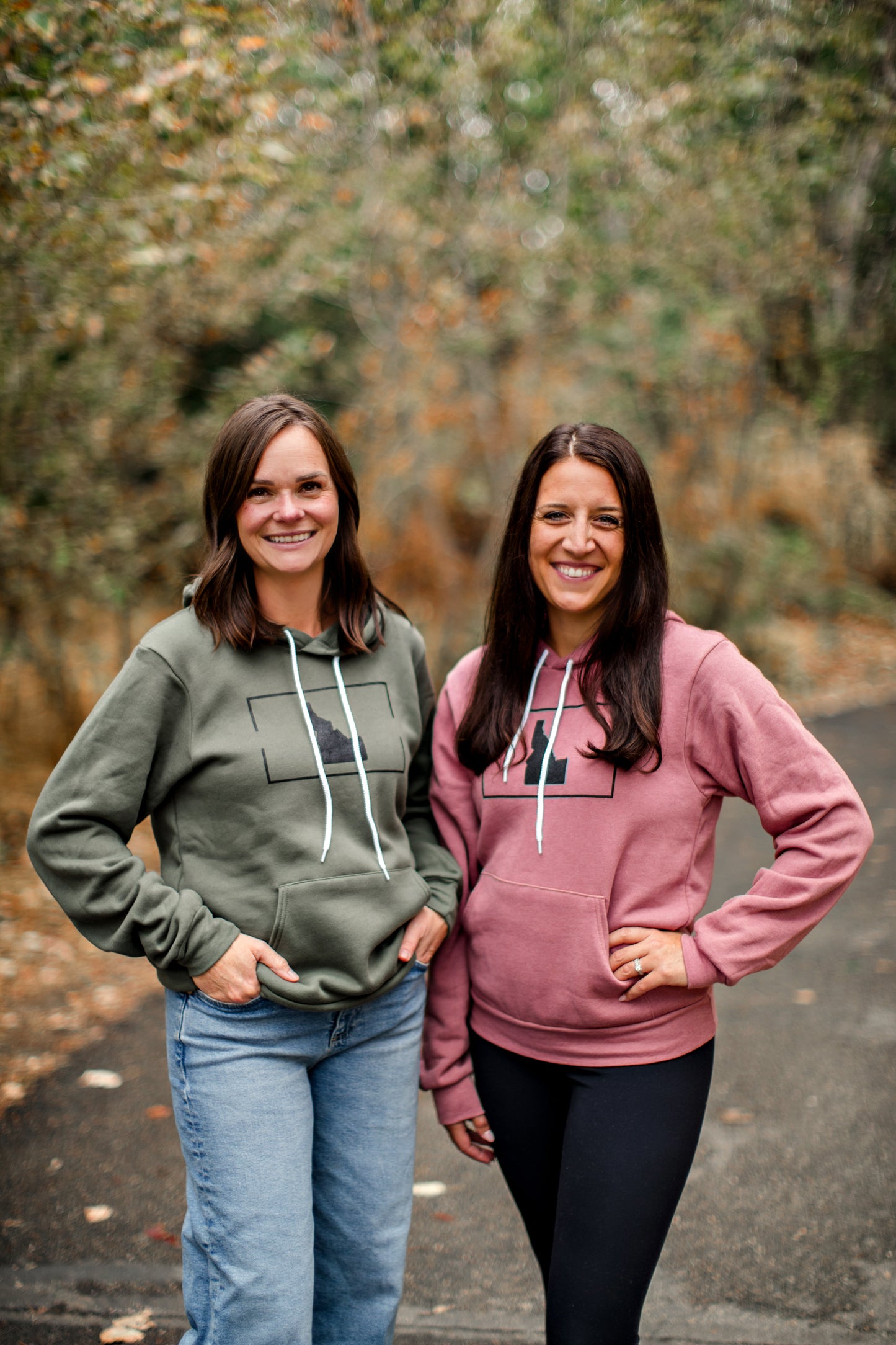 Two Idaho mamas wearing matching Idaho sweaters. The sweaters are so soft and so cozy. The sweaters have an Idaho design on the front, simple Idaho. 