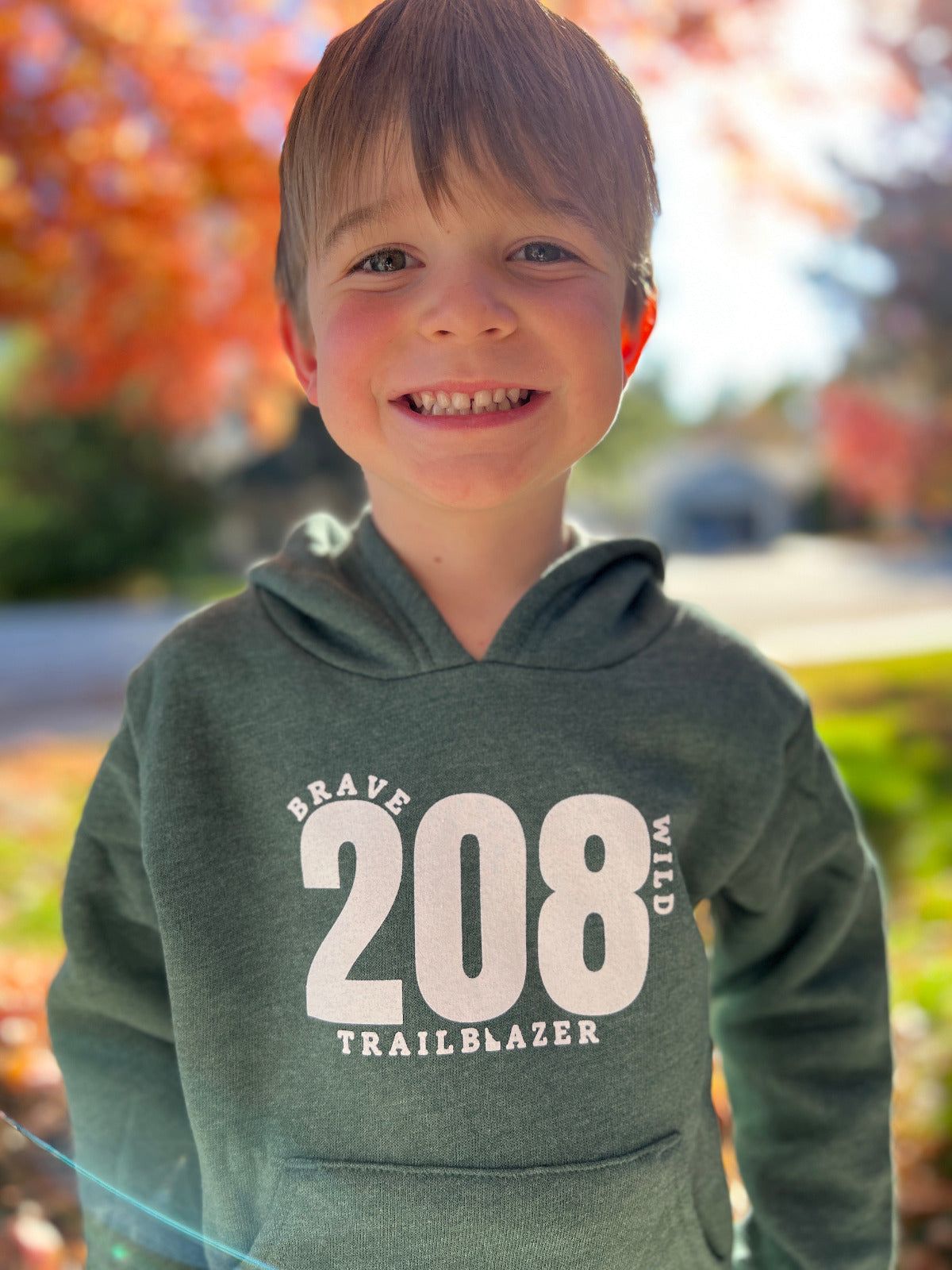 The Dark green forest hoodie is cozy and comfy. Idaho apparel is made for Idaho Kids. TatorJo is made for Idaho Kids. Idaho clothing states 208 on the front. This stands for Idaho. The love for Idaho.
