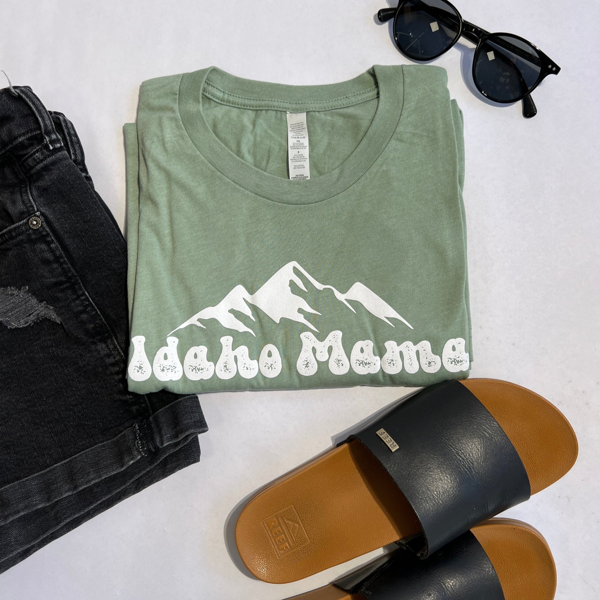 This Idaho Mama T Shirt is designed and screen printed in Idaho. It is a product of TatorJo, an Idaho Apparel Company. This T shirt has Idaho Mama written on the front. It is cute and cozy and oh so soft!