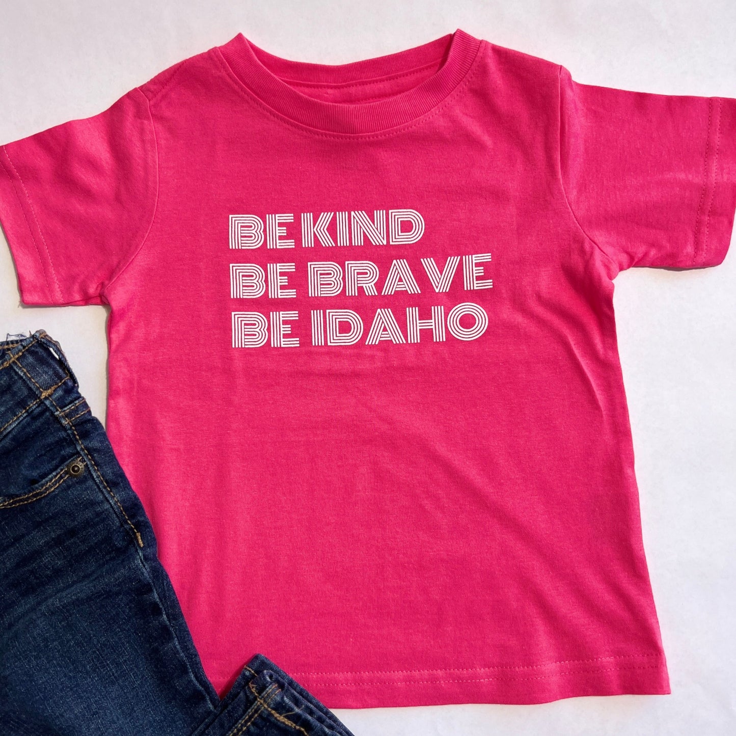 This Idaho T shirt is made for Idaho. It's focus is to bring joy and bravery to idaho Kids. Idaho apparel company, TatorJo, designs this shirt and screen prints right here in Idaho.