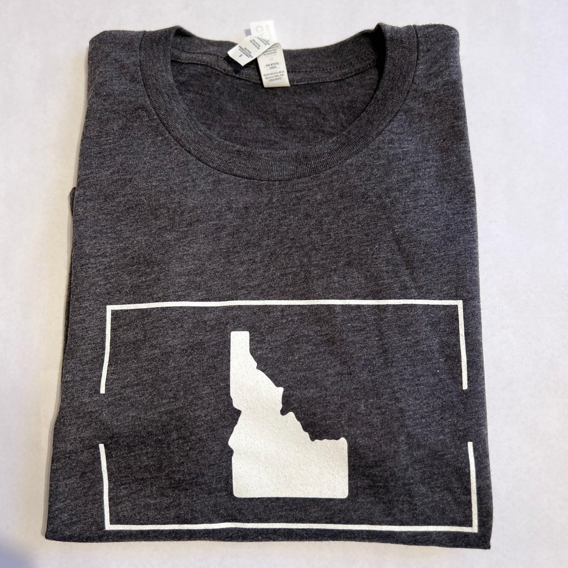 This Idaho T Shirt is designed in Idaho by TatorJo, an Idaho Apparel Company. The T shirt has Idaho on it with a simple and classic design. This Idaho T Shirt can be dressed up and dressed down. It is a unisex t shirt, gray, with a white Idaho on it. This t shirt is cotton and polyester and ultra soft and comfortable. All t shirts are screen printed in Idaho. 