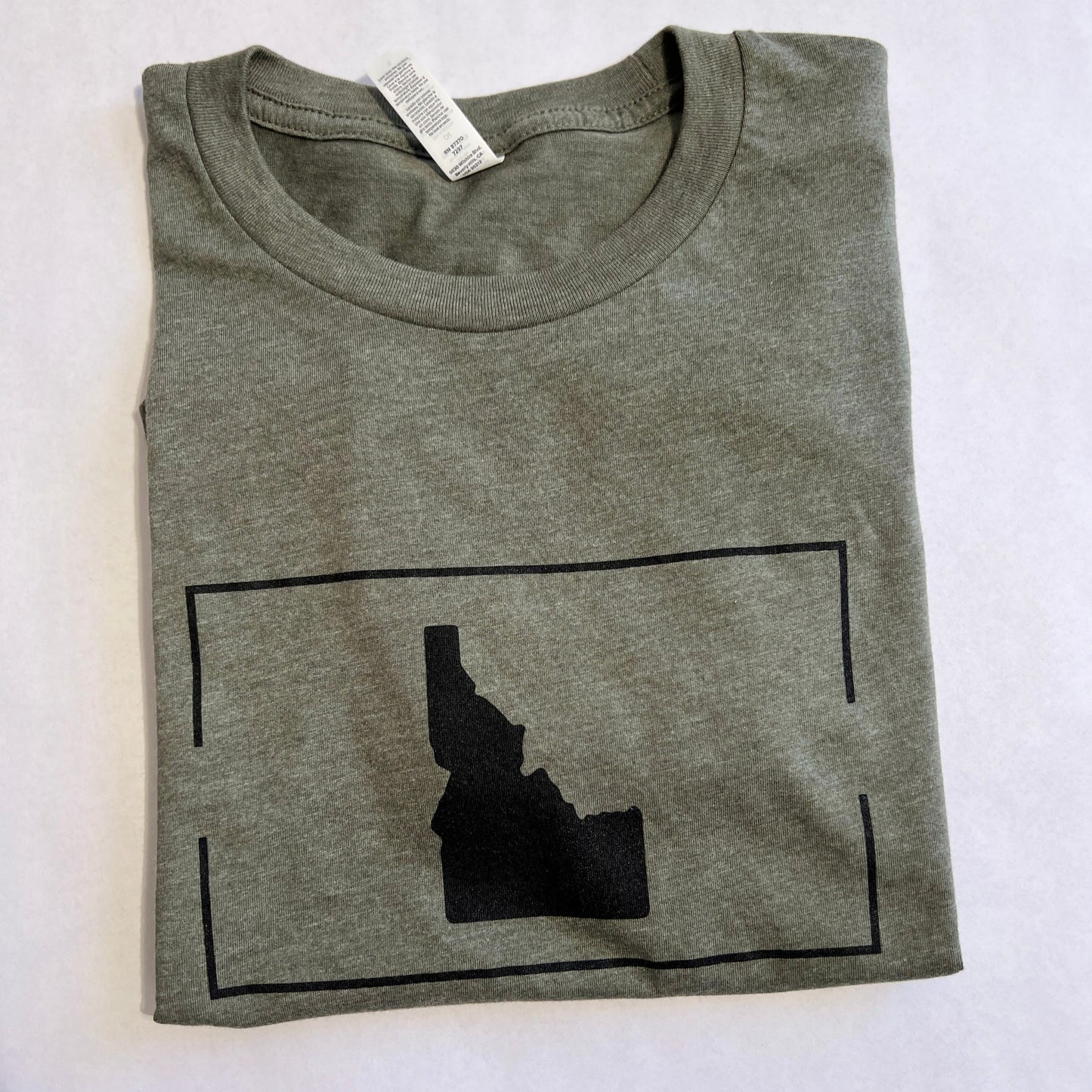 This Idaho T shirt is a classic design. It is simple and clean, showcasing the love for Idaho on it. This Idaho apparel piece is designed and screen printed in Idaho. This military green is a unisex shirt, both men and women can wear Idaho t shirts wherever they go!