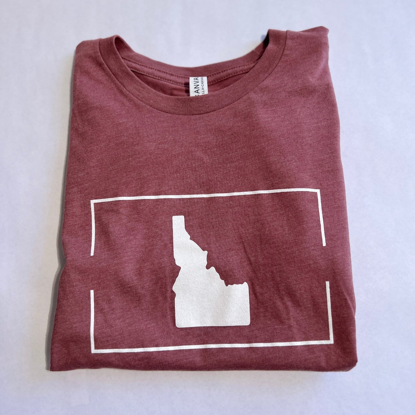 This Idaho T Shirt is designed by TatorJo, an Idaho Apparel Company. The Idaho T Shirt has a simple and clean classic Idaho on it. This Idaho T Shirt is screen printed in Idaho and owned and operated in Idaho. This Idaho T Shirt is cozy and soft on a preshrunk t shirt.