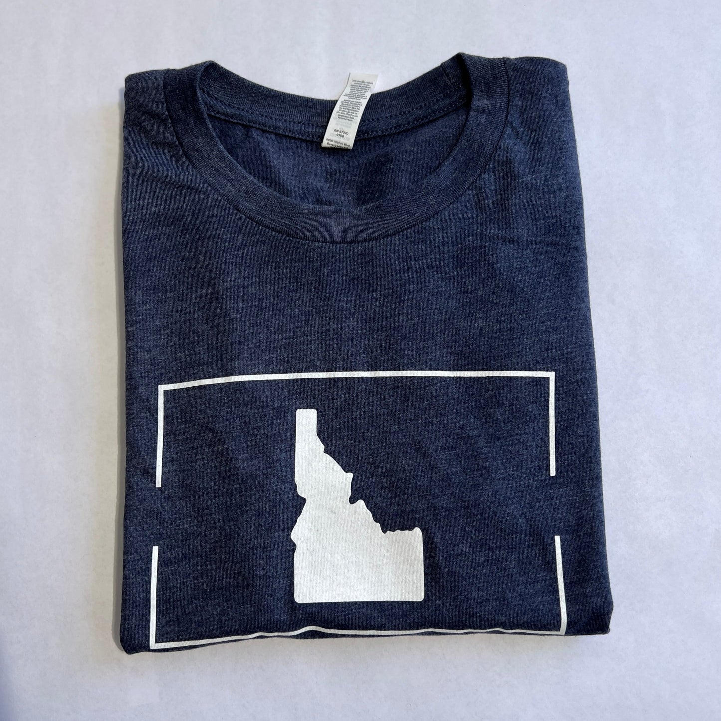 This Heather Navy Idaho T Shirt is ultra soft and cozy. It has a simple Idaho on the front with a classic clean feeling. This T Shirt is designed by TatorJo, an Idaho Apparel company owned and operated in Idaho. Durability is our focus, all items are screen printed in Idaho. This Idaho T shirt is screen printed in Idaho. Grab yourself this Idaho T shirt today!
