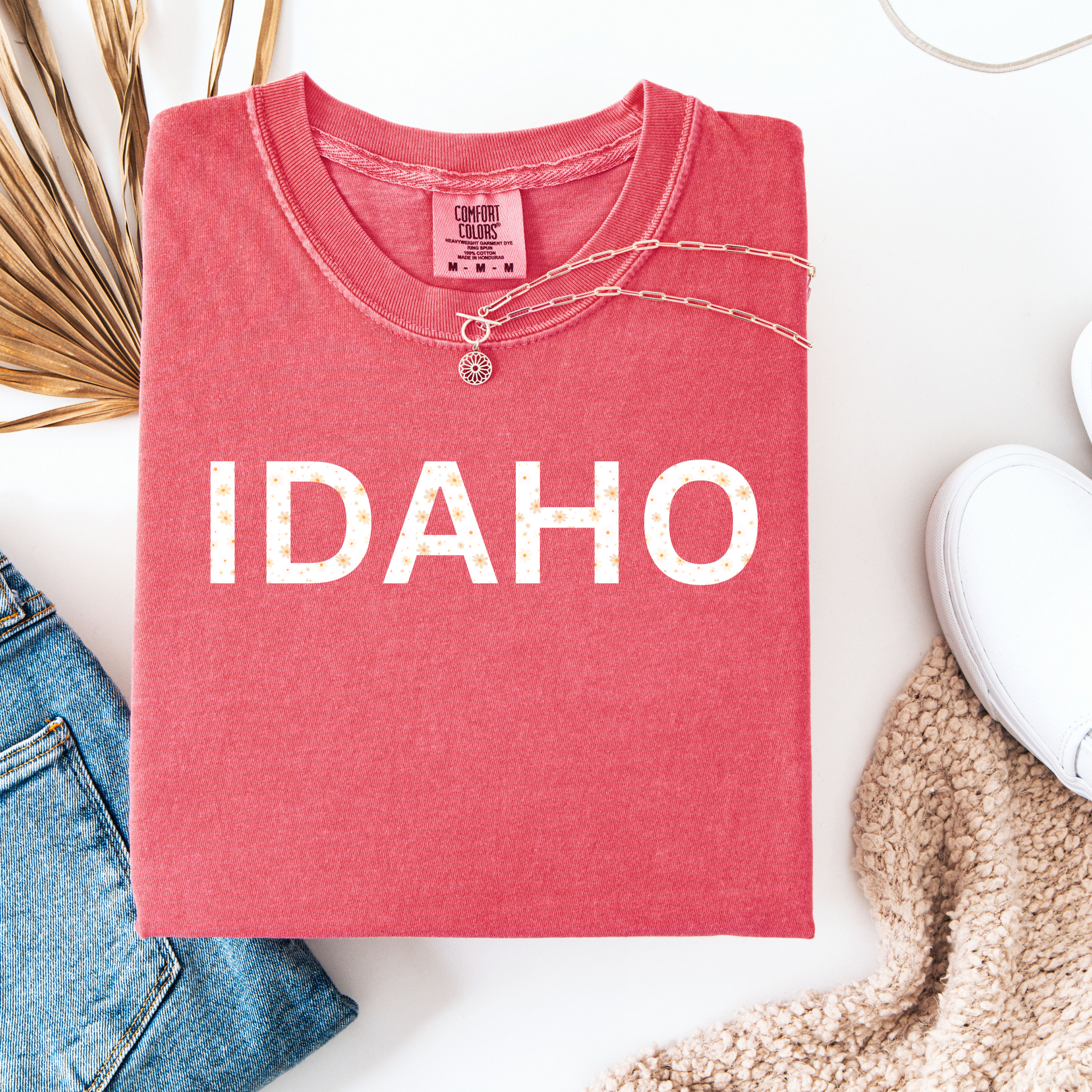Cute Idaho T Shirt with the words Idaho on it. The Idaho T shirt has floral designs inside. Designed by TatorJo