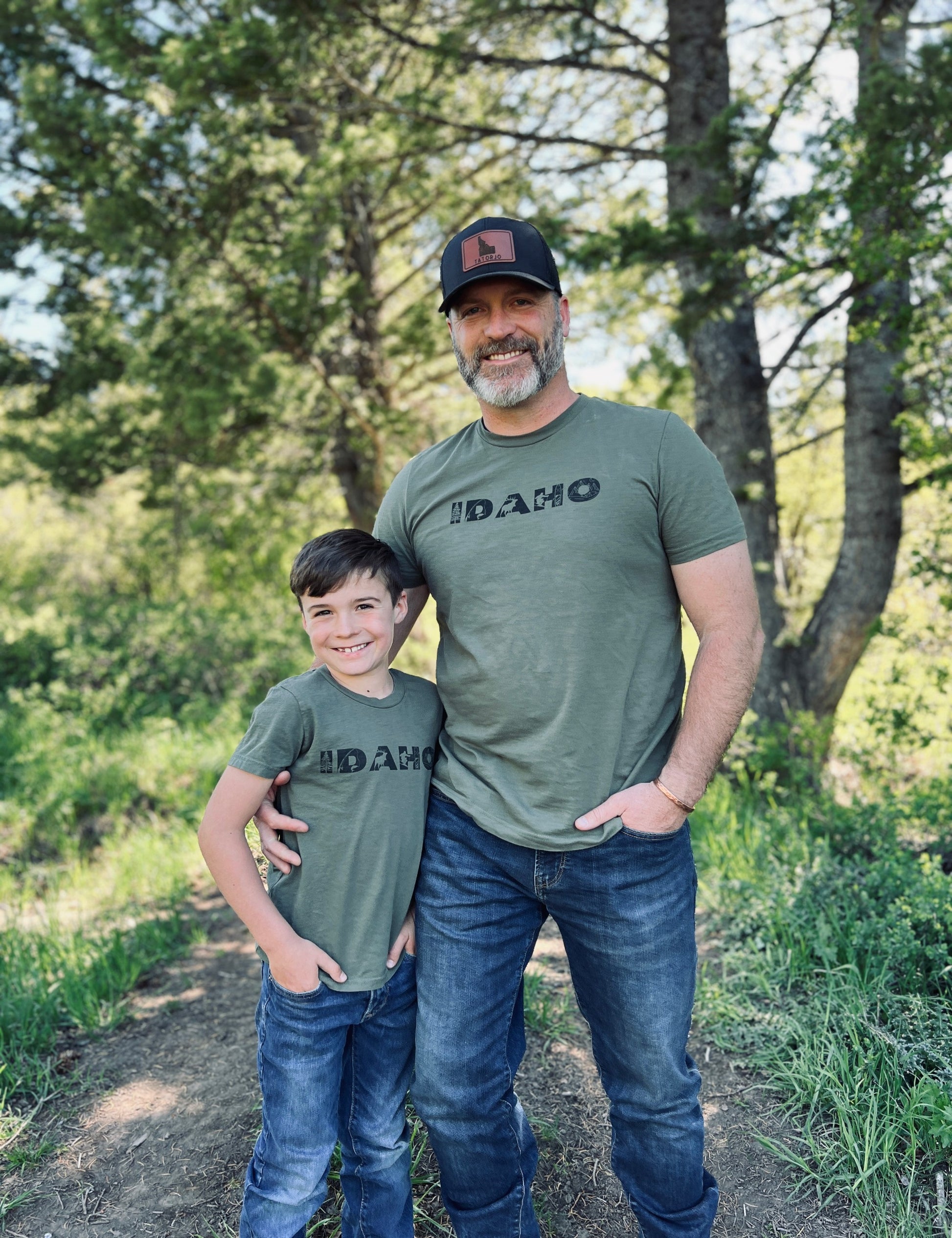 Dad and son standing outside in Idaho T shirts. 