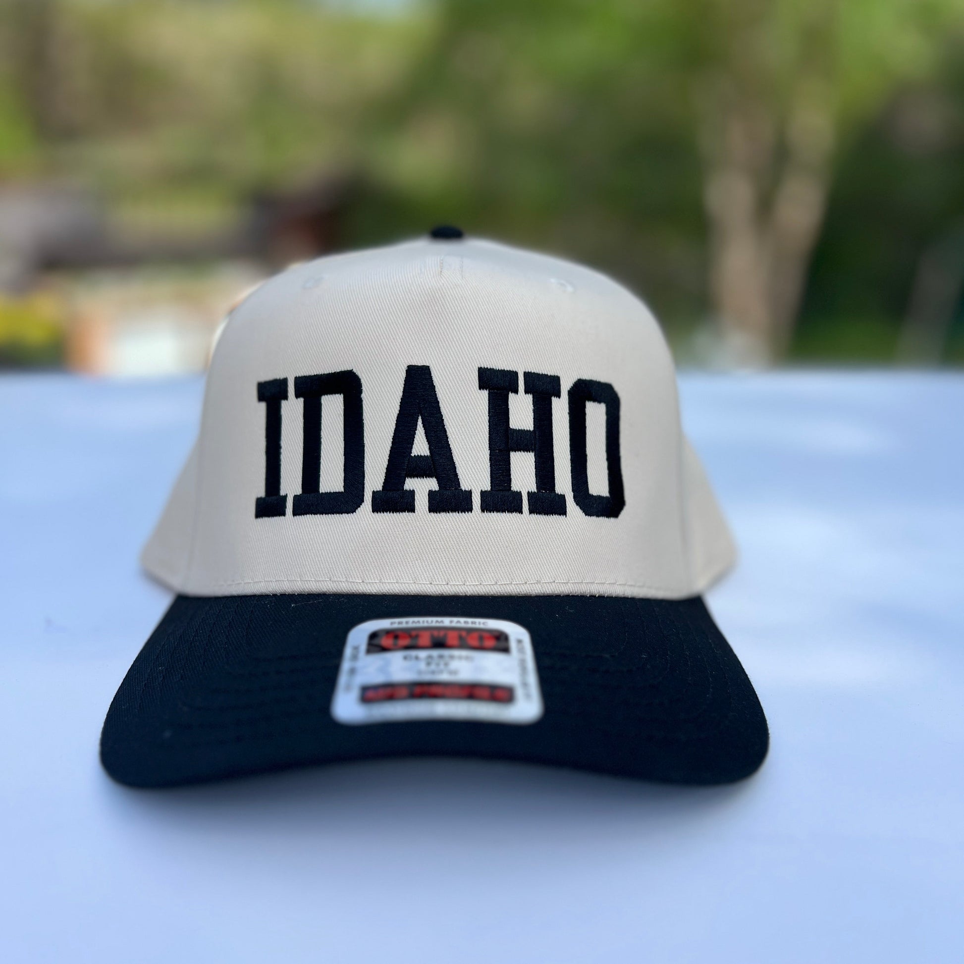 This Idaho Hat says idaho on it. Plain, simple text on a classic style hat. Idaho Hats, designed by TatorJo
