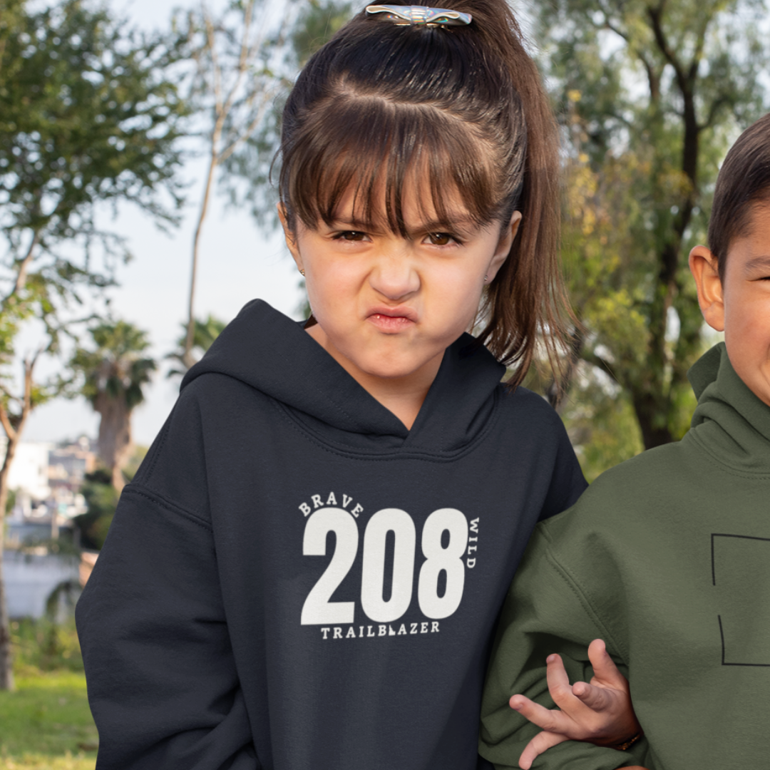 A girl wearing a Trailblazer 208 hoodie, sold by TatorJo.