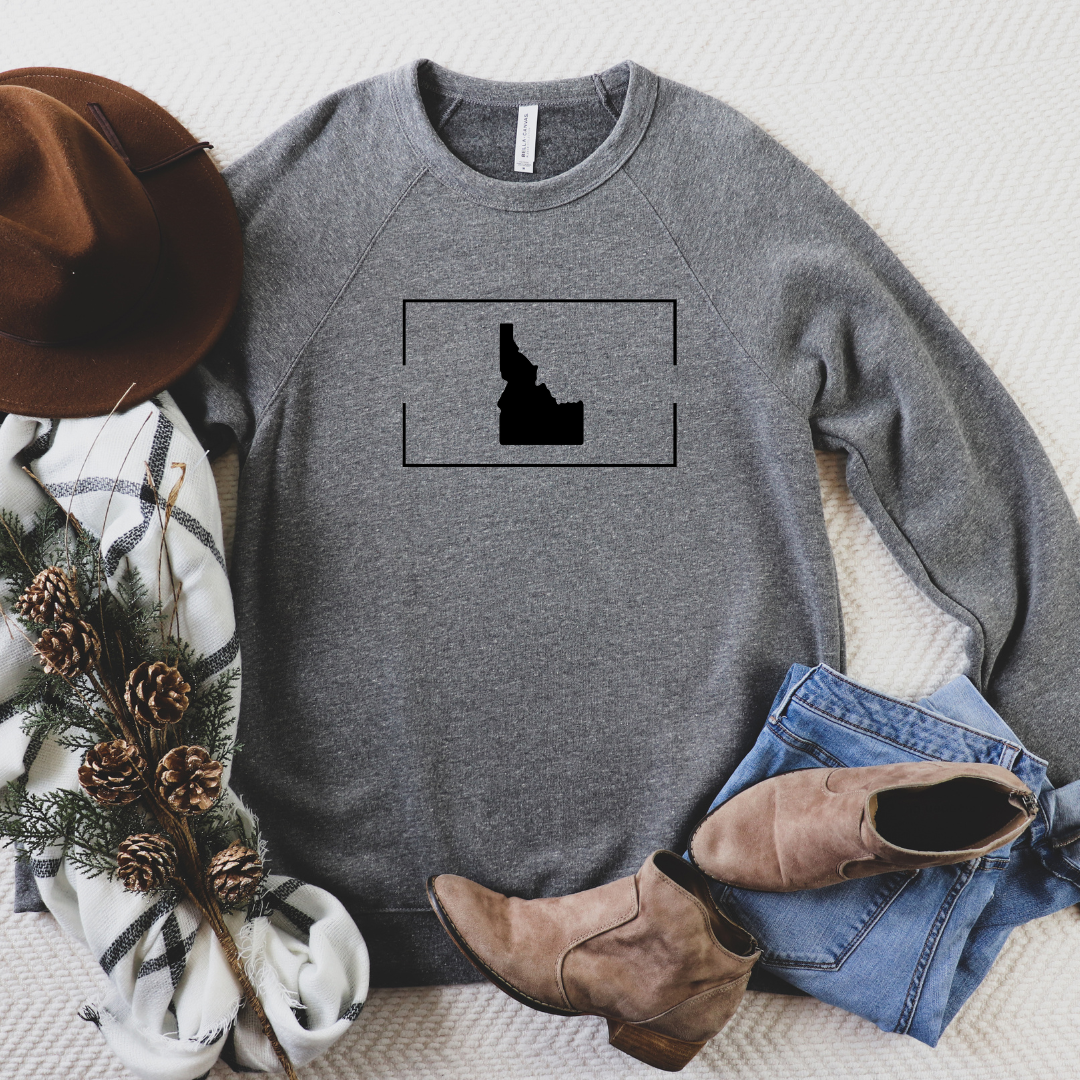 This Idaho Clothing is the must own in your wardrobe. This gray Idaho sweater has an Idaho design on it. This Idaho sweater is designed by TatorJo, a local Idaho company.