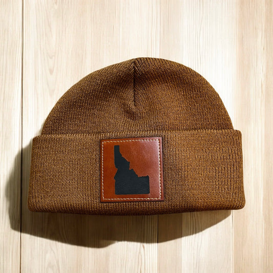 This adorable Idaho beanie is made for the babies. This beanie is a caramel color with an Idaho leather patch on the front. It is ultra warm and so thick, it will keep babies warm all winter. It is also adorable!